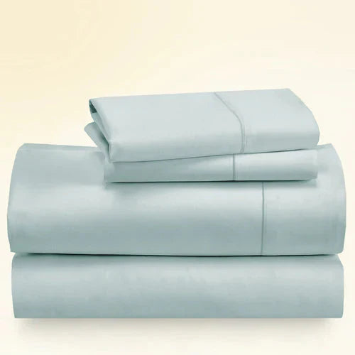 "CinchFit King Sheet Set in light blue, 400TC cotton with deep pockets. Soft, breathable, and secure fit for king mattresses."